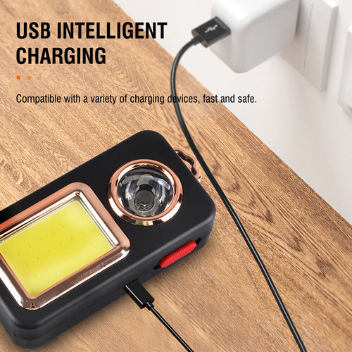 CampGlow lantern charging over USB on a wooden table