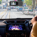 RoadWatch 2K dash camera mounted on a windscreen with the road ahead in view